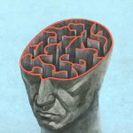 Human head, with brain outline representing a maze.