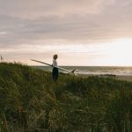 Surfer stares into horizon