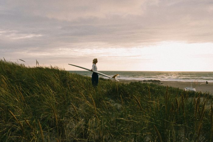 Surfer stares into horizon